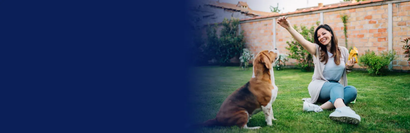 woman playing with dog in mosquito free yard